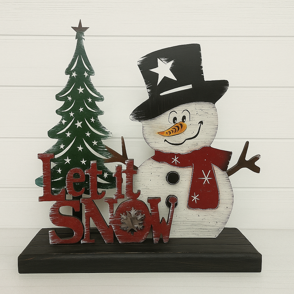 Decorative sign with snowman, Christmas tree, and 'Let it Snow' text on a white background